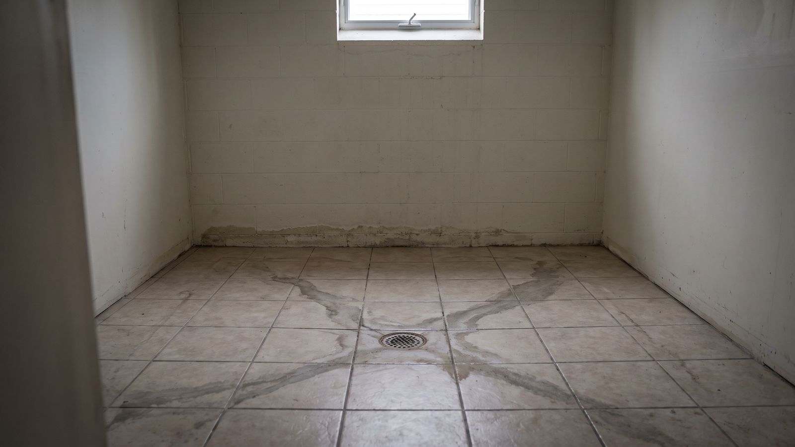 Staining fanning out from a basement floor drain Staining fanning across basement floor tile from a floor drain: does homeowners insurance cover sewage backup