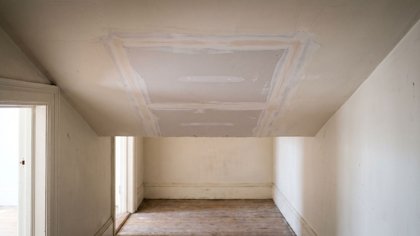 New Ceiling Drywall Patch With Feathered Joints New drywall patch in a ceiling with taped joints feathered in compound: water leak from upstairs neighbor ceiling