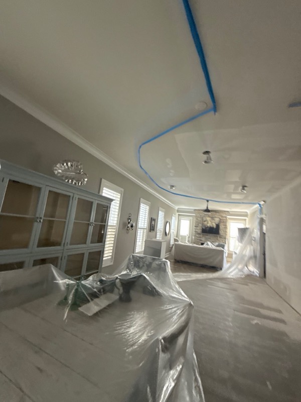 Ashburn, VA basement after emergency water extraction with drying equipment staged